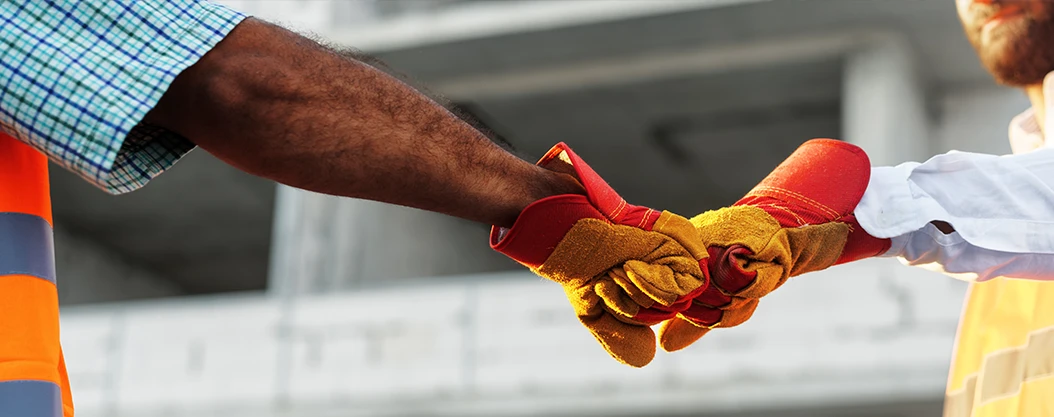 construction site prospecting fist bump